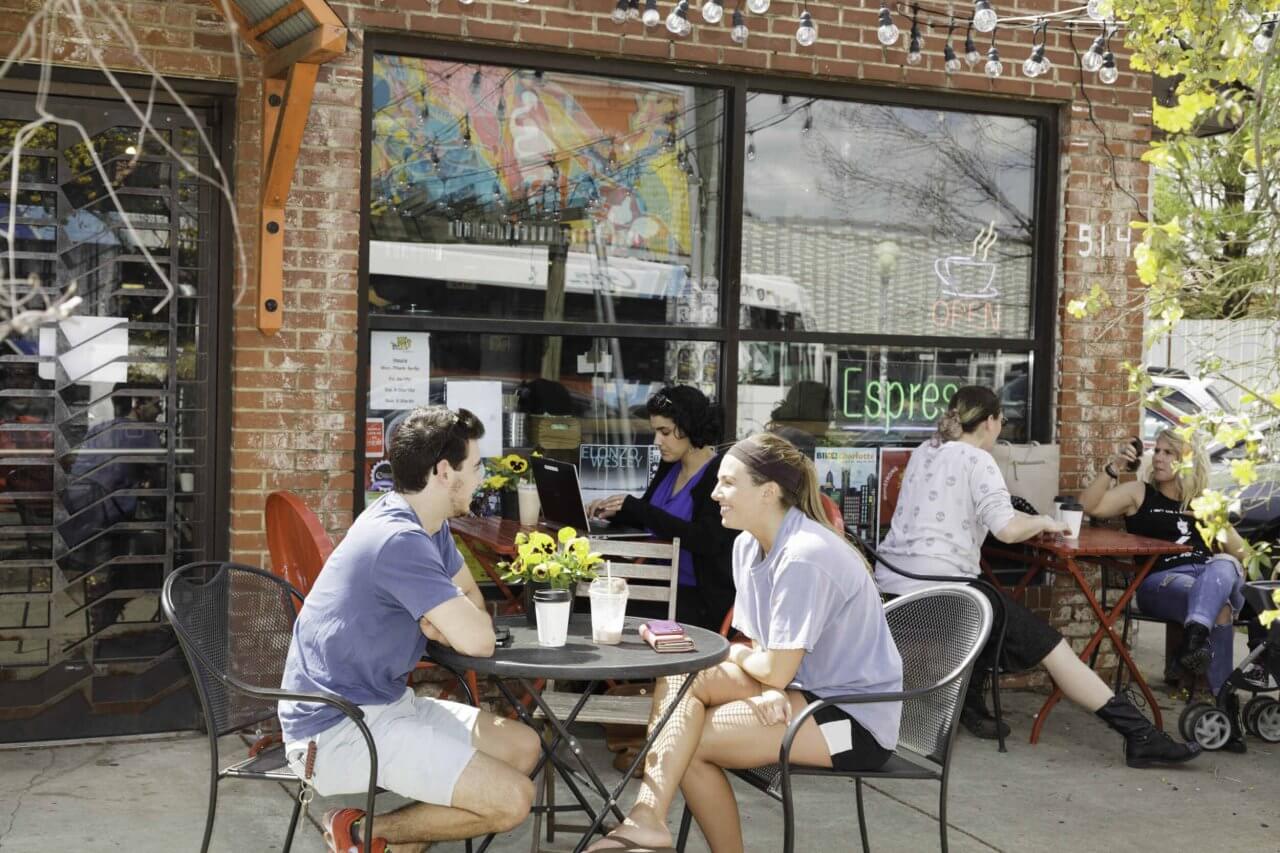 two people dining near the henry noda apartments